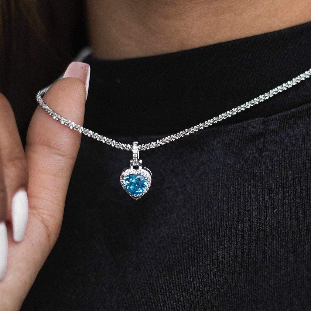 Iced Heart Cz Pendant In White Gold Blue Stone